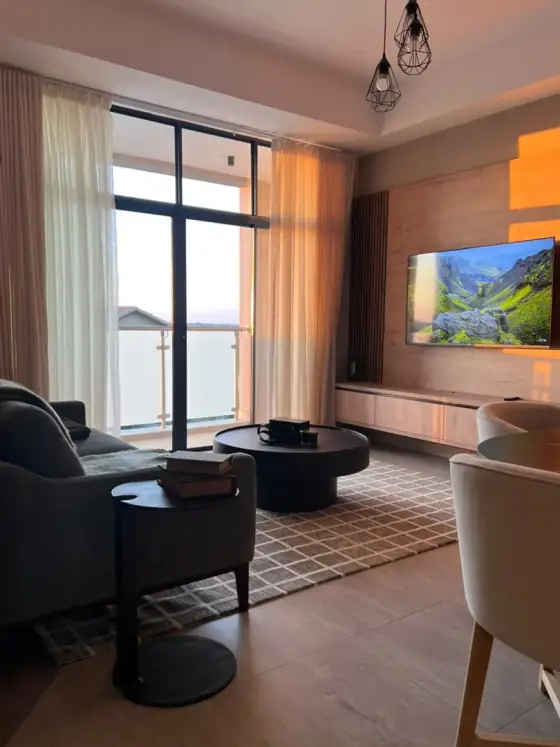 Living room at L’étoile de Rêve with warm lighting and refined furnishings